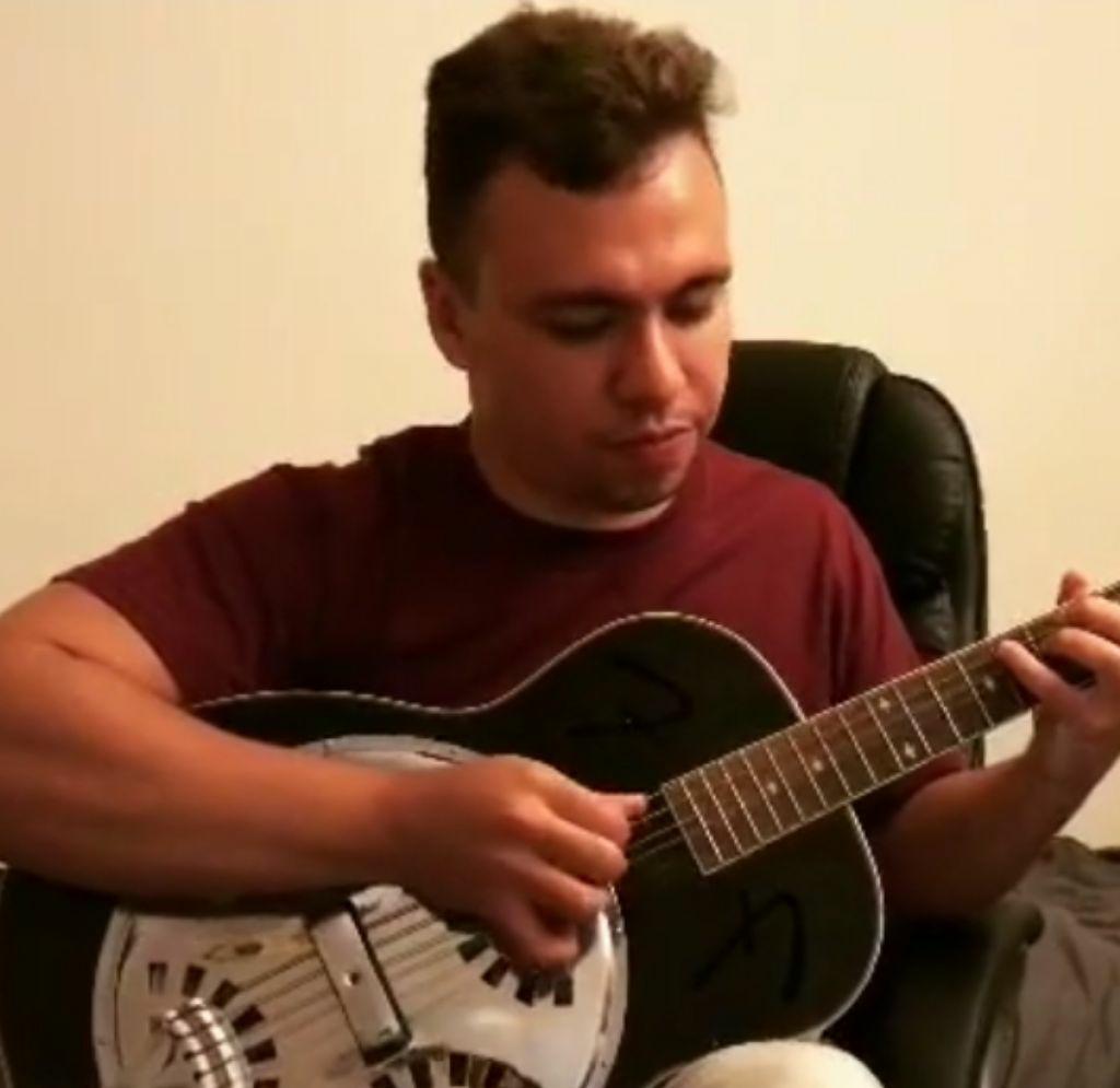 Allan F playing guitar